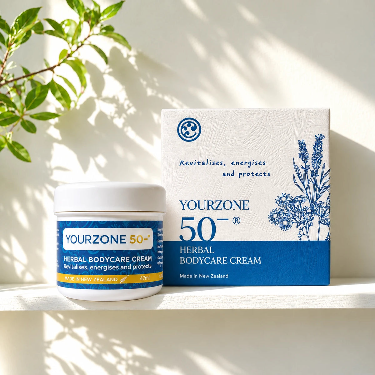 YourZone 50− Herbal BodyCare Cream jar and box on a sunlit white shelf